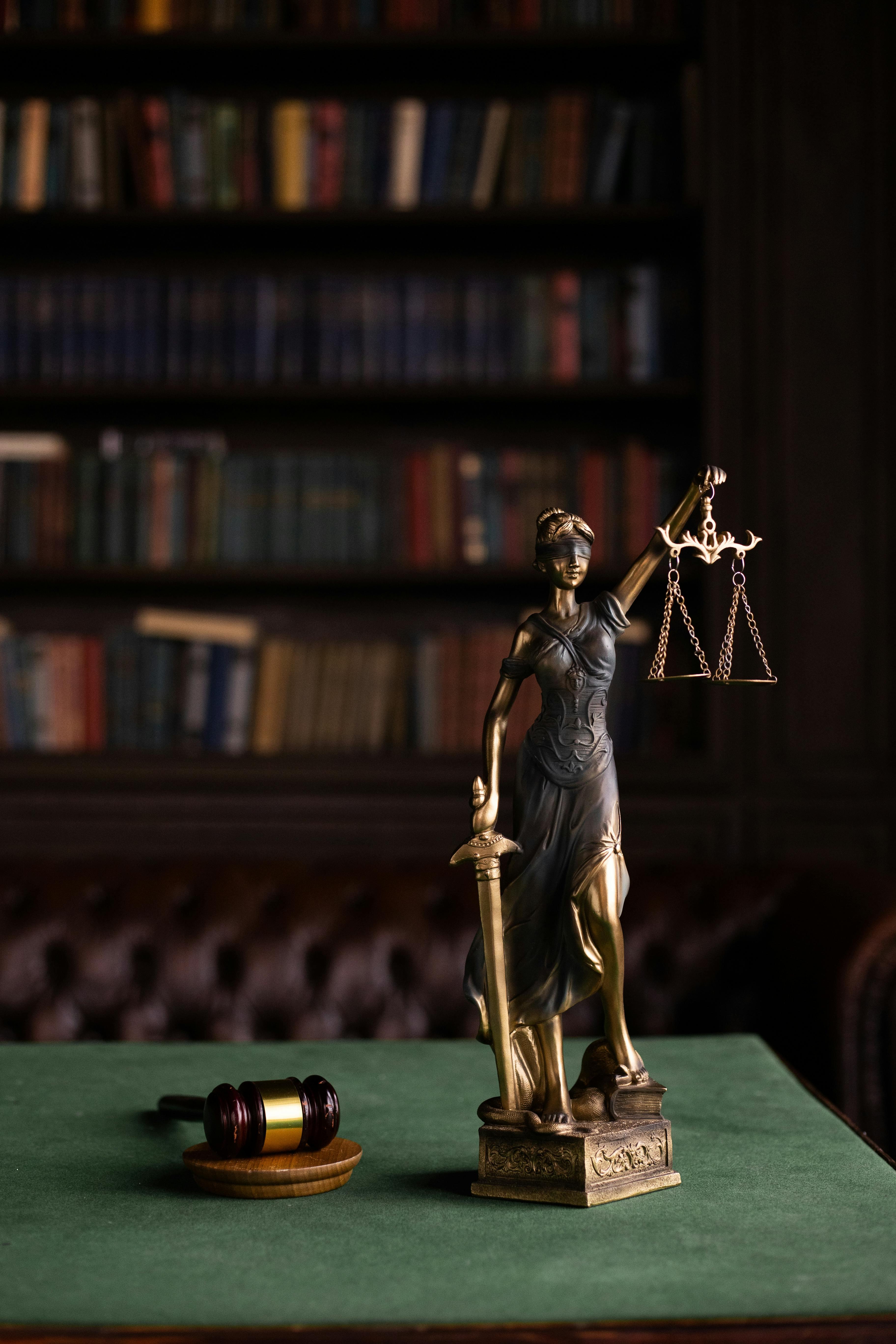 lady justice statue on a desk